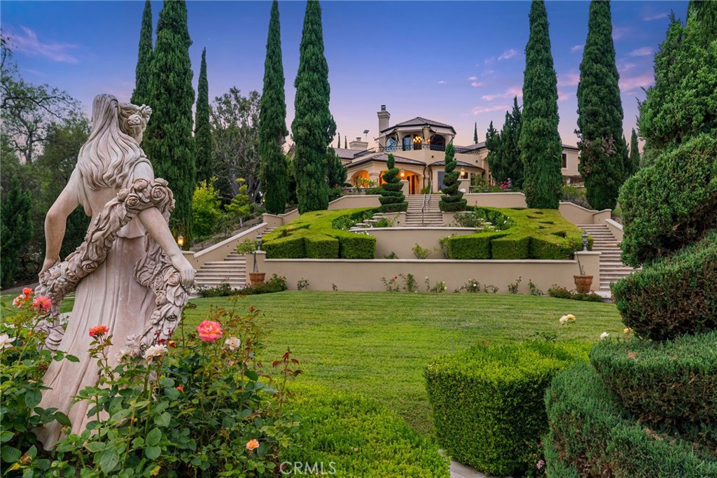 26501 Silver Saddle Lane Laguna Hills, CA 92653 - Photo 34 of 59 a view of a garden with a building in the background