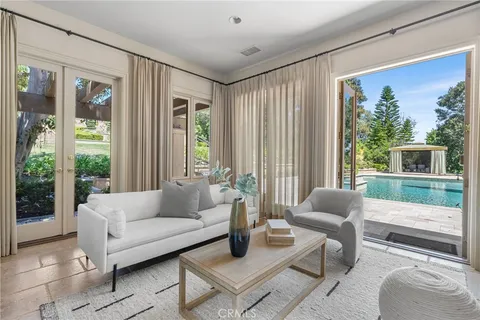 a front view of a house with yard and green space