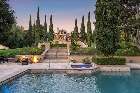 a view of a wooden dinning table and chairs in the patio