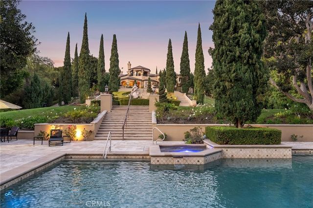 a view of a wooden dinning table and chairs in the patio