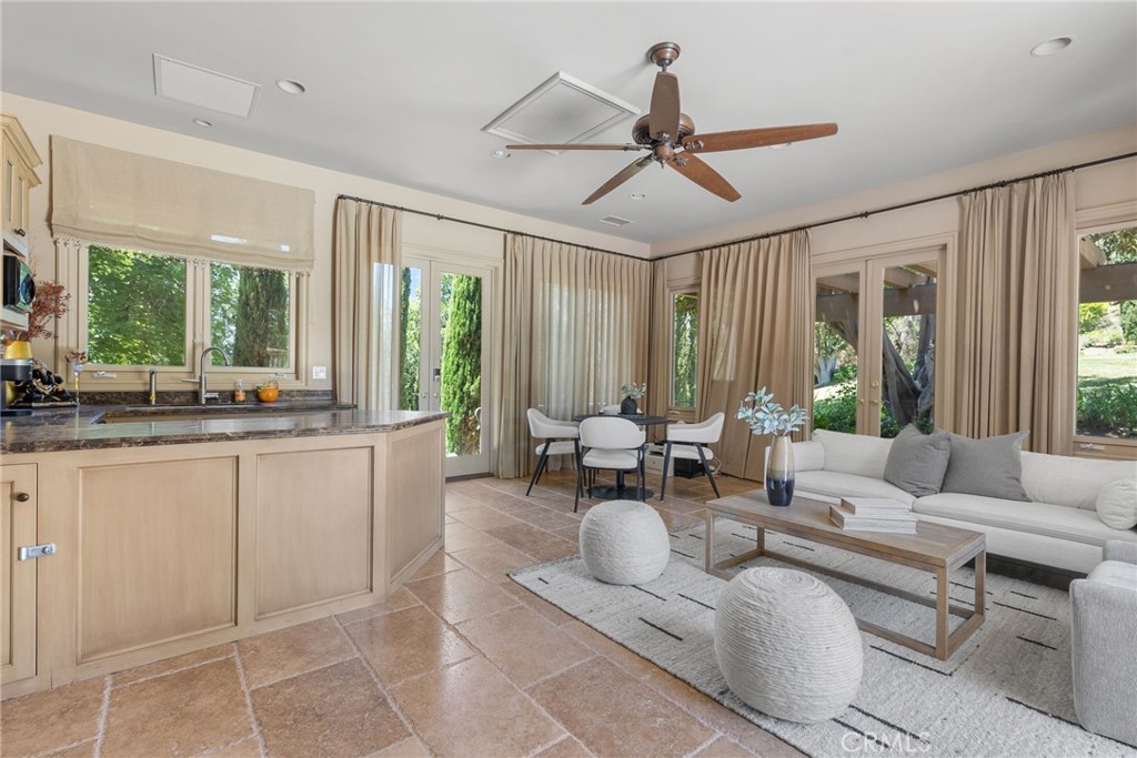 26501 Silver Saddle Lane Laguna Hills, CA 92653 - Photo 41 of 59 a living room with furniture and floor to ceiling windows