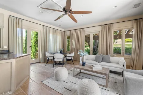 a view of a dining room with furniture and a chandelier