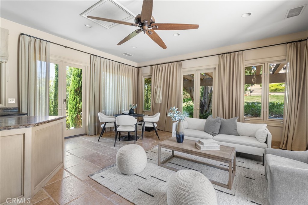 26501 Silver Saddle Lane Laguna Hills, CA 92653 - Photo 42 of 59 a living room with furniture and a large window