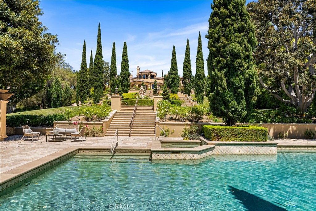 26501 Silver Saddle Lane Laguna Hills, CA 92653 - Photo 45 of 59 a view of swimming pool with lawn chairs and plants