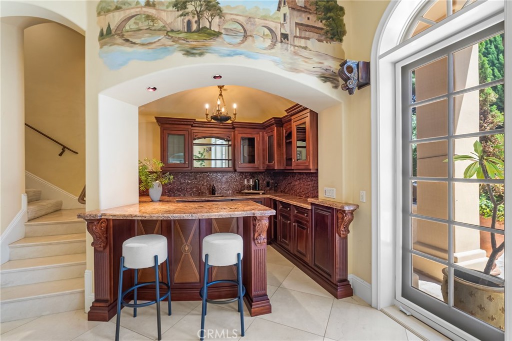 26501 Silver Saddle Lane Laguna Hills, CA 92653 - Photo 47 of 59 a view of a dining room with furniture and a chandelier