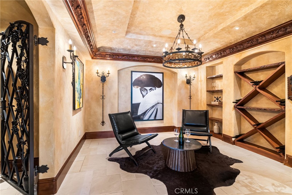 26501 Silver Saddle Lane Laguna Hills, CA 92653 - Photo 48 of 59 a living room with fireplace furniture and a chandelier