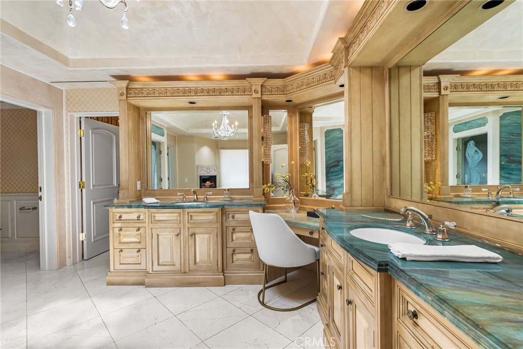 26501 Silver Saddle Lane Laguna Hills, CA 92653 - Photo 49 of 59 a bathroom with a granite countertop sink and a mirror