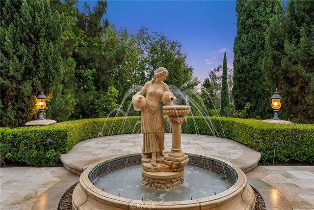 a view of a fountain in the garden