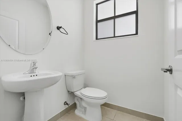 a close view of a utility room with dryer and washer