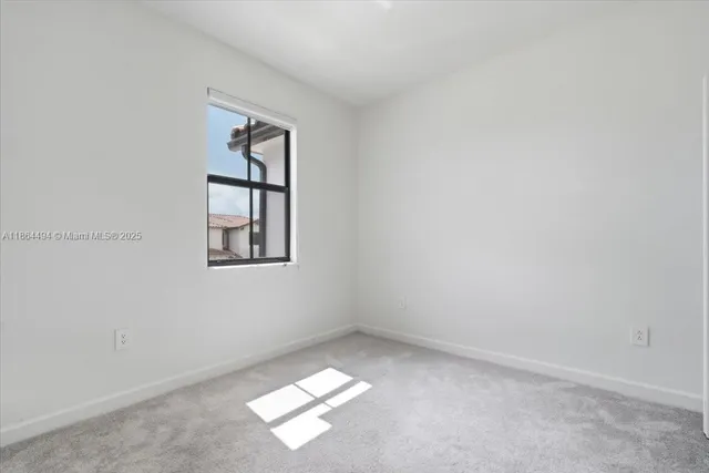 a kitchen with stainless steel appliances a refrigerator sink and microwave