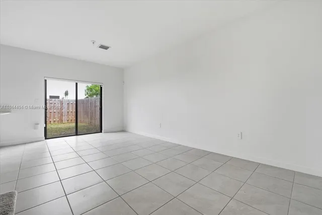 a kitchen with cabinets stainless steel appliances and a counter top space