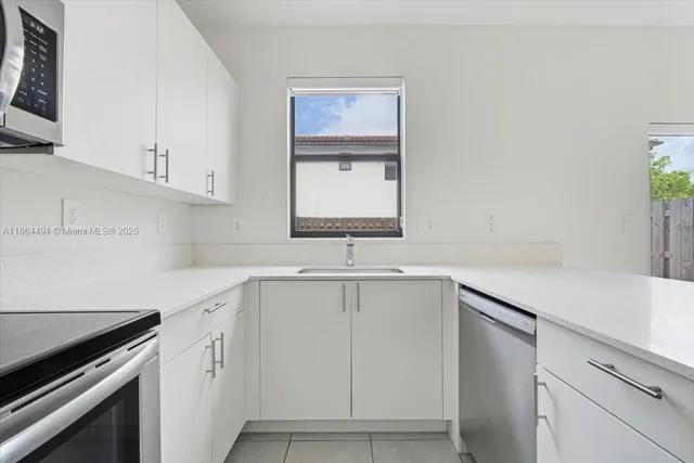 a view of entryway with stairs and a rug