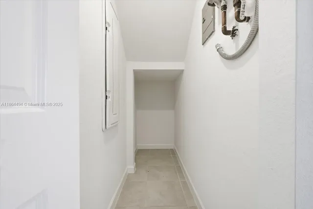 a view of an empty room and window