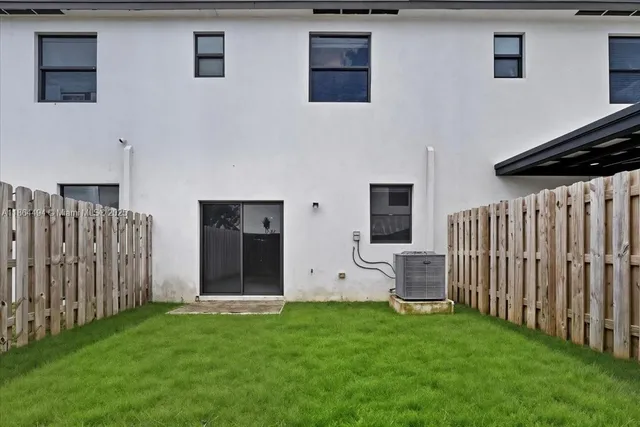 a view of a backyard of the house