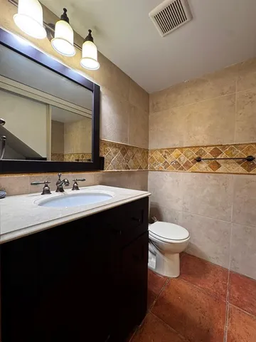 a bathroom with a sink and a toilet