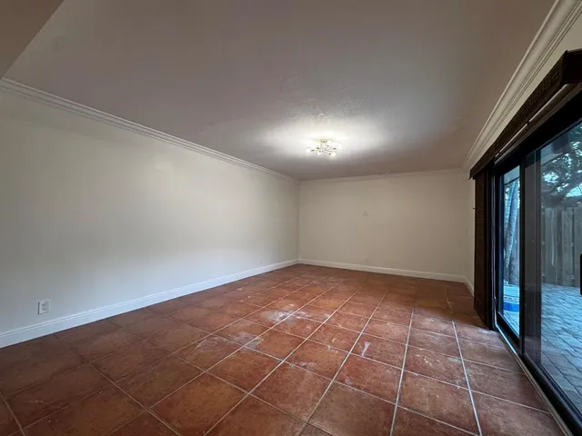 a view of an empty room and window