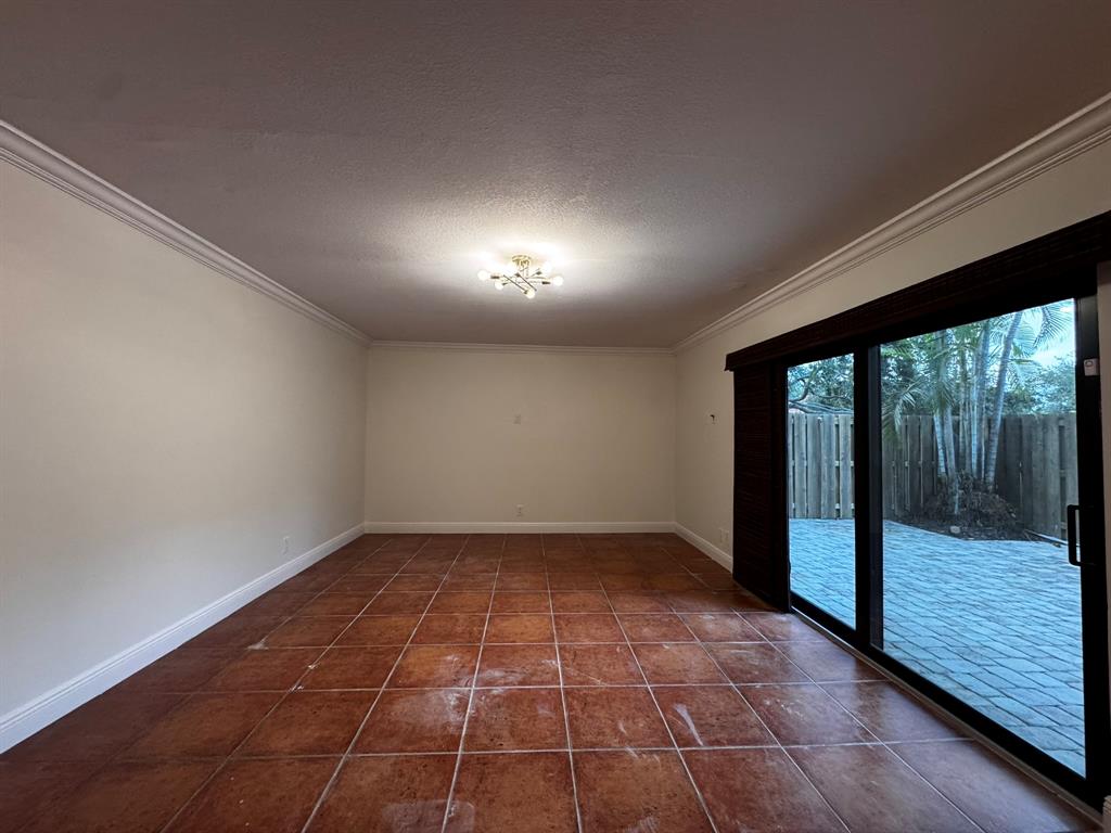 3205 Spanish Wells Drive, Unit C Delray Beach, FL 33445 - Photo 19 of 20 a view of an empty room with a window