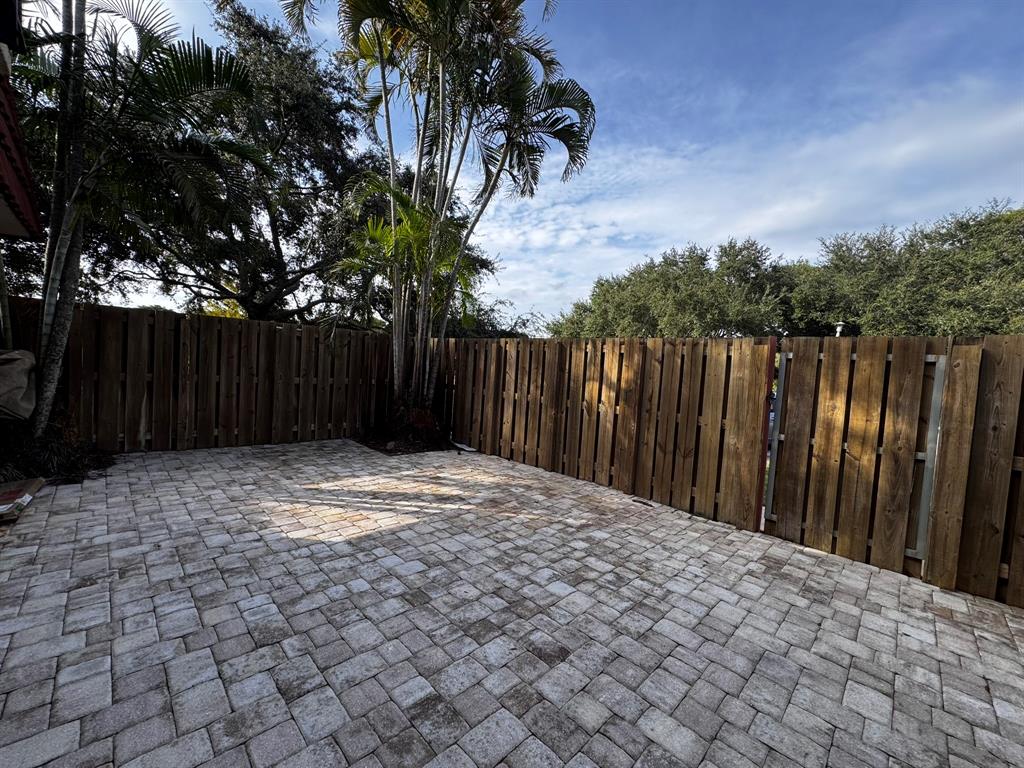 3205 Spanish Wells Drive, Unit C Delray Beach, FL 33445 - Photo 2 of 20 a view of wooden fence
