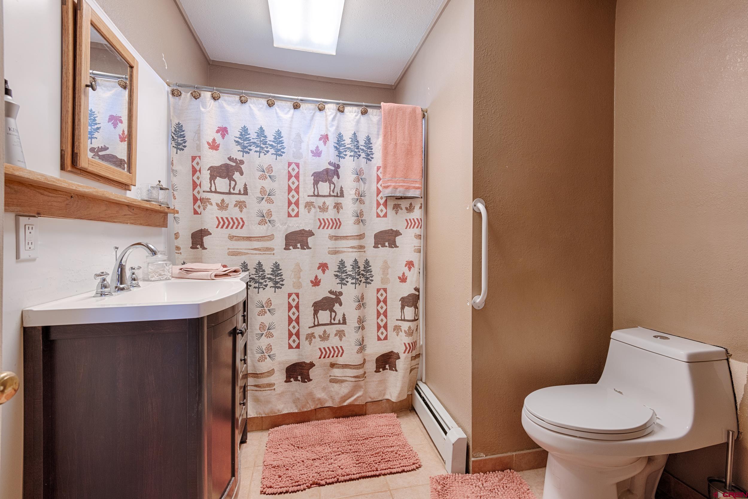 959 1500th Road Delta, CO 81416 - Photo 20 of 35 a bathroom with a sink toilet and shower