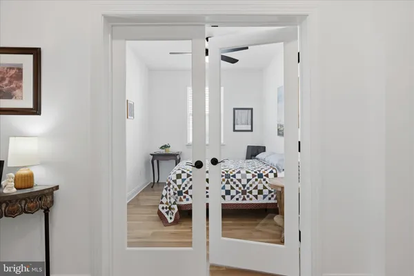 a bedroom with a bed and a table in it