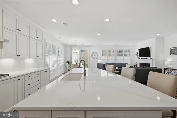 a living room with a couch and a lamp