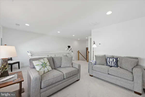 a workspace with furniture and a chandelier fan