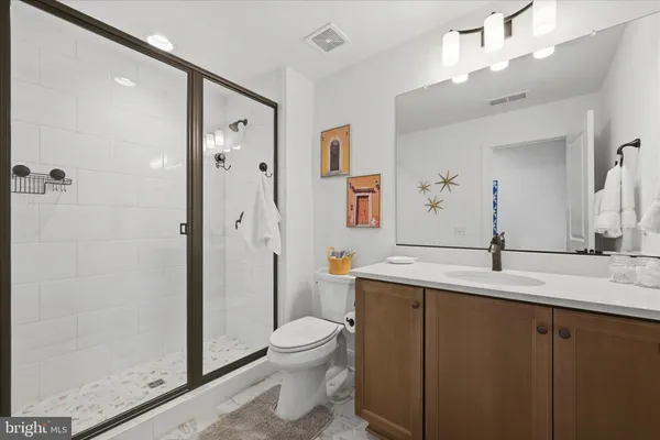 a bedroom with a bed and a potted plant