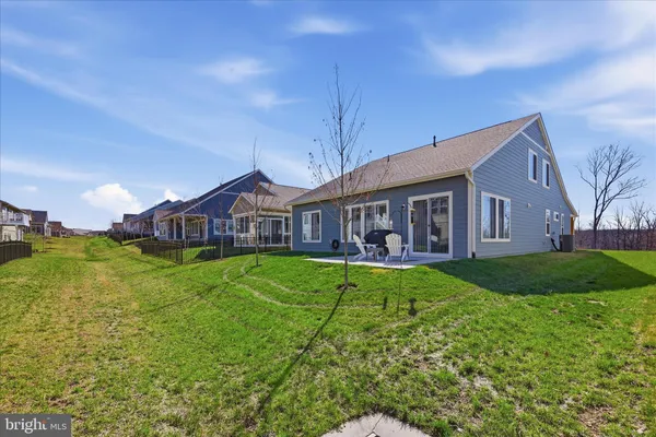 an aerial view of a house with a lake view