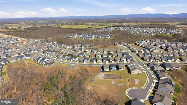 a room with furniture pool table and flat screen tv