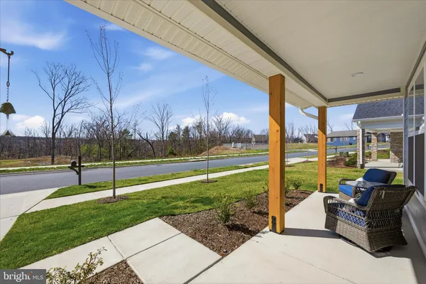 a outdoor living space with furniture and a garden