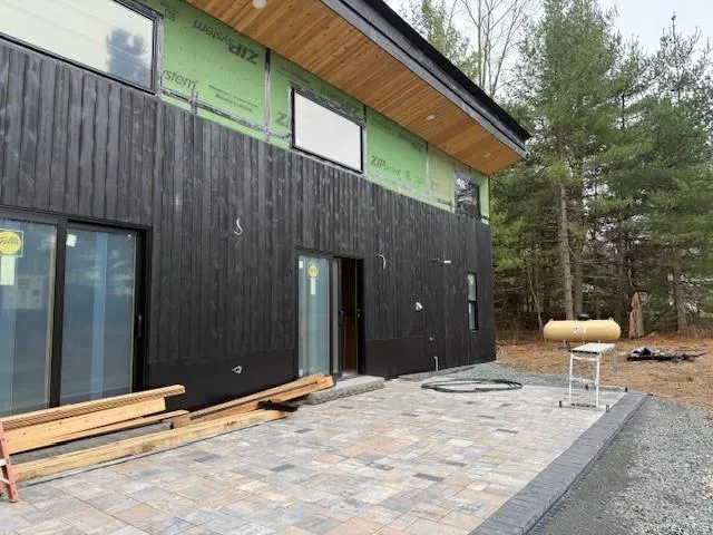 a backyard of a house with wooden fence