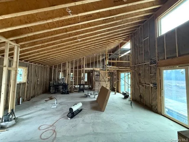 a building outdoor space with patio furniture and shower