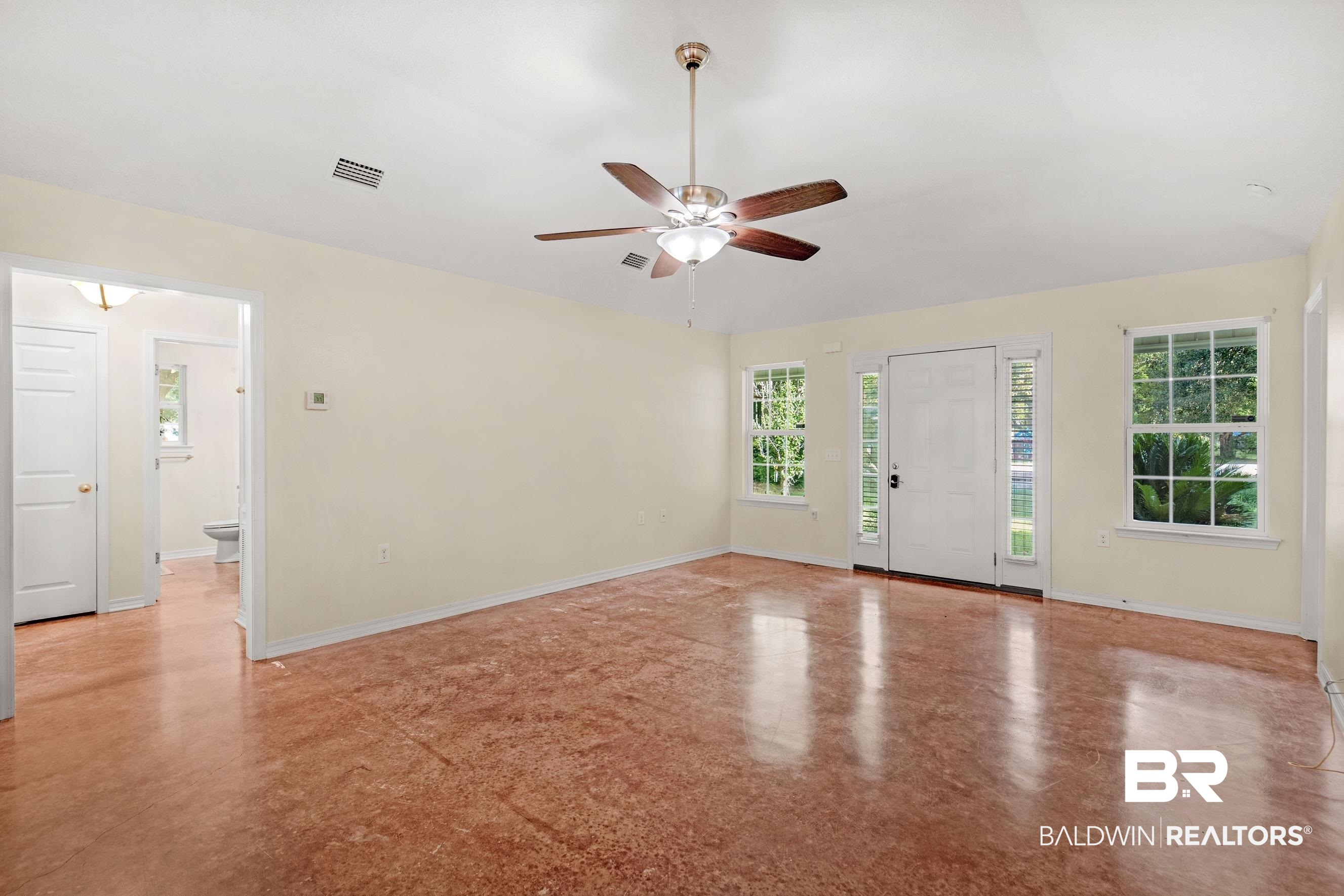 36087 Byrd Road Stapleton, AL 36578 - Photo 11 of 27 Unfurnished room with plenty of natural light and ceiling fan
