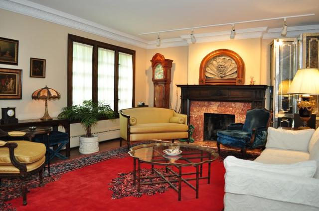 304 Gage Road Riverside, IL 60546 - Photo 3 of 25 a living room with furniture a fireplace and a flat screen tv