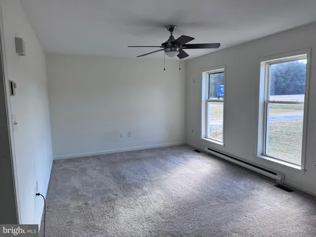 a view of an empty room with a window