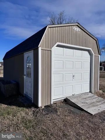 a view of backyard with cabin
