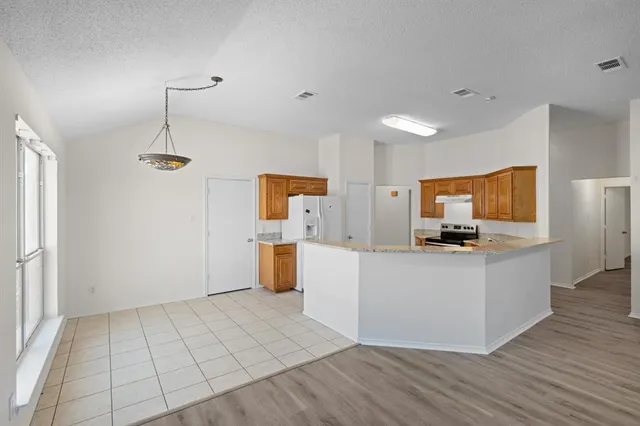 a view of work space with wooden floor