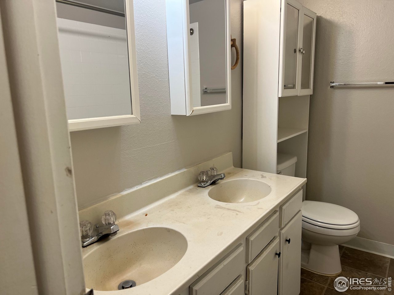 1705 Heatheridge Road, Unit 104 Fort Collins, CO 80526 - Photo 10 of 14 a bathroom with a sink toilet and vanity