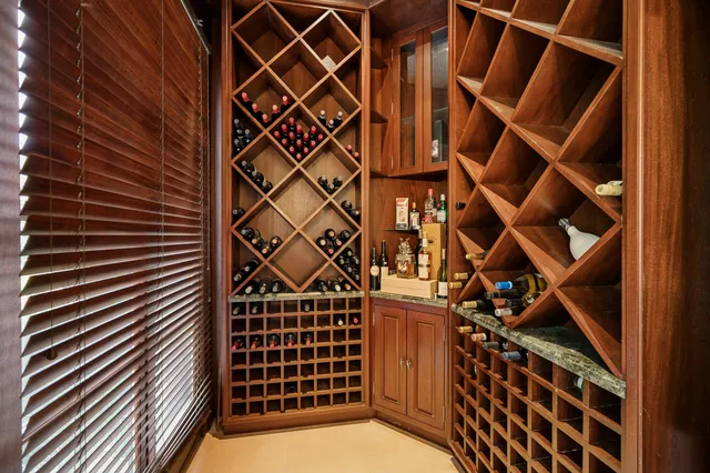 a bedroom with a bed wooden floor and fireplace