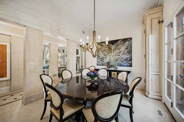 a bedroom with furniture and a large window