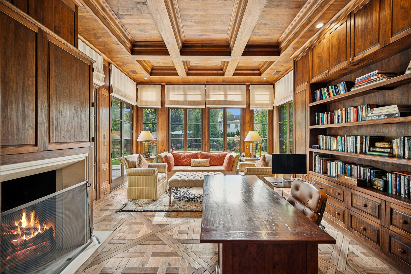 528 Roslyn Road Kenilworth, IL 60043 - Photo 35 of 63 a living room with furniture a bookshelf and a book shelf