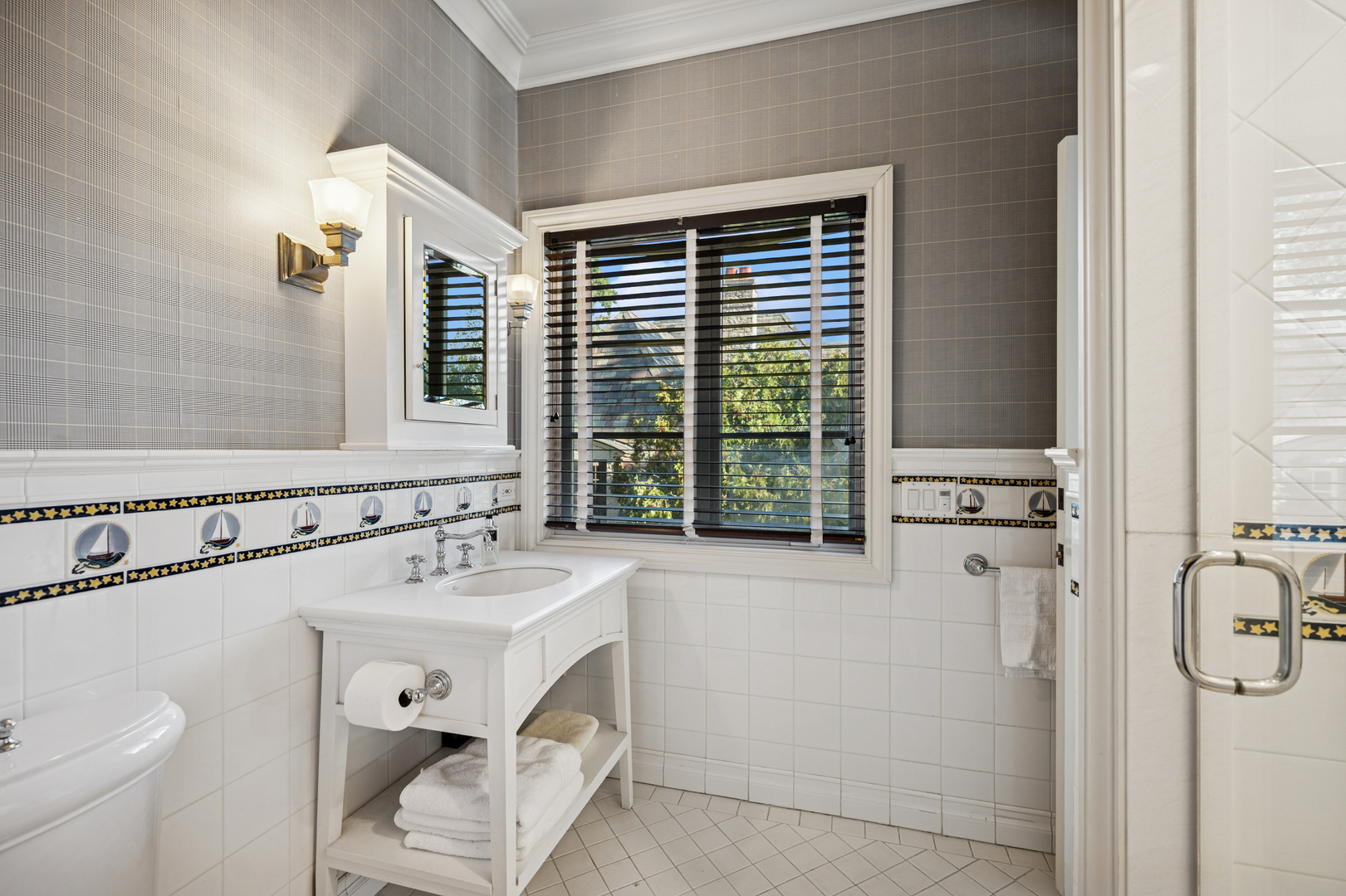 528 Roslyn Road Kenilworth, IL 60043 - Photo 48 of 63 a bathroom with a sink and a toilet