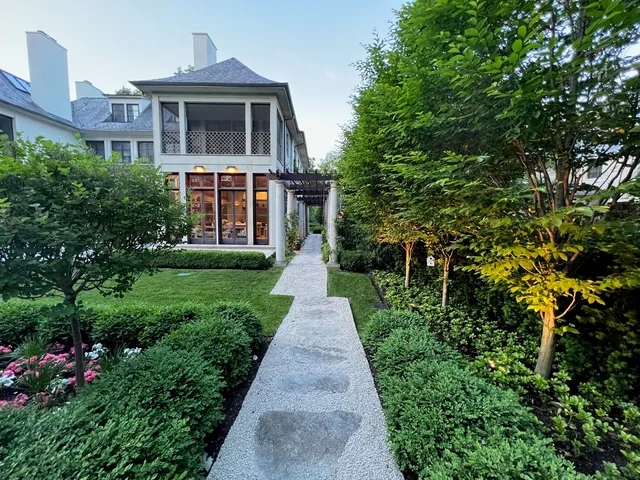 a view of garden with plants and trees