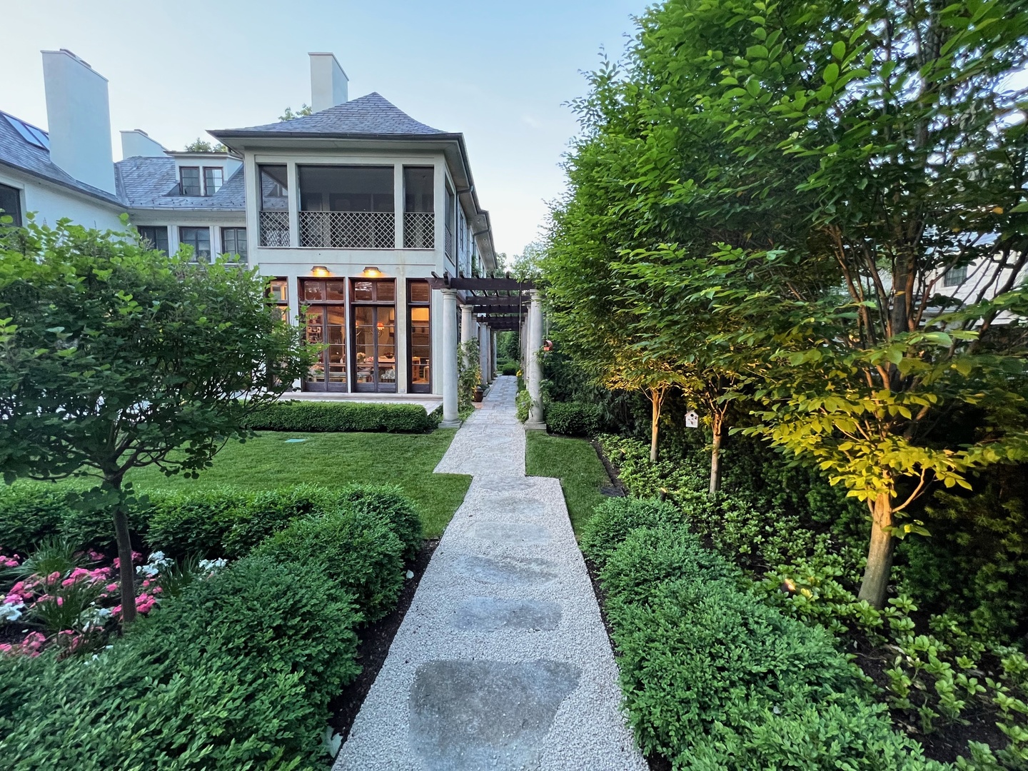 528 Roslyn Road Kenilworth, IL 60043 - Photo 9 of 63 a front view of a house with a yard and trees
