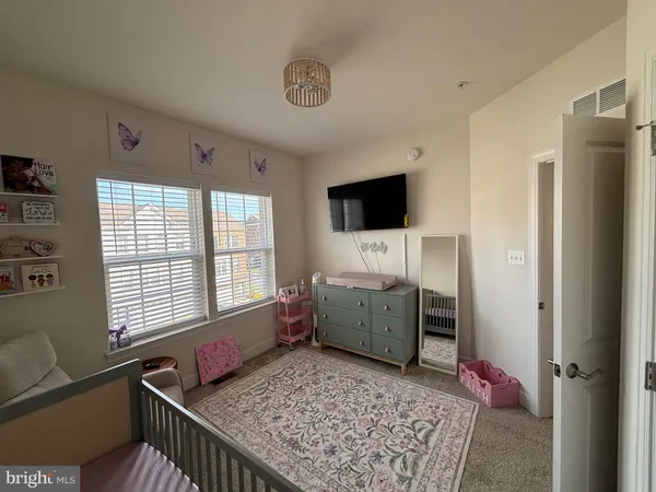 a room with furniture and flat screen tv