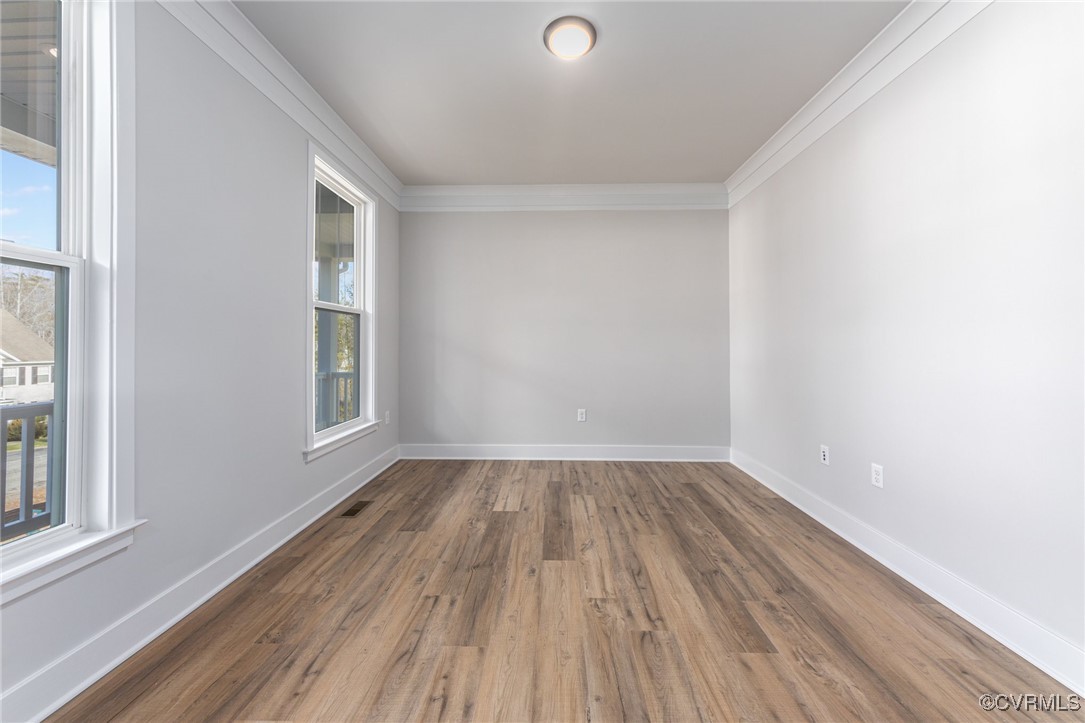 8205 Colise Lane Spotsylvania, VA 22553 - Photo 20 of 32 a view of an empty room with wooden floor and a window