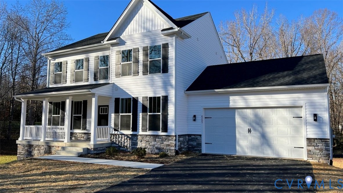 8205 Colise Lane Spotsylvania, VA 22553 - Photo 2 of 32 a front view of a house with a yard
