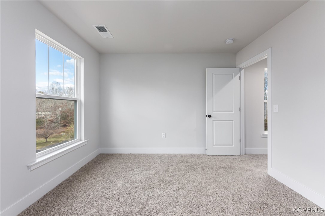 8205 Colise Lane Spotsylvania, VA 22553 - Photo 22 of 32 an empty room with windows and closet