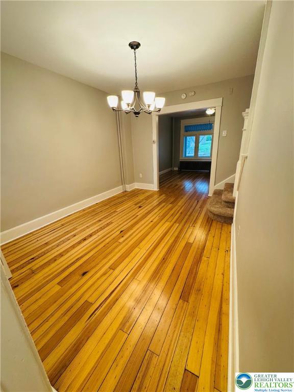 823 Spring Street Bethlehem, PA 18018 - Photo 7 of 39 a view of a room with wooden floor and chandelier