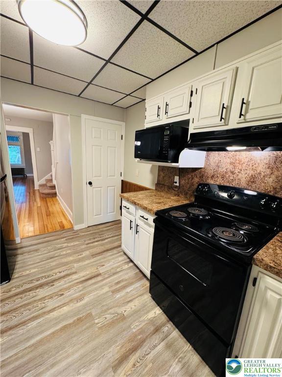 823 Spring Street Bethlehem, PA 18018 - Photo 8 of 39 a kitchen with stainless steel appliances granite countertop a stove and a microwave